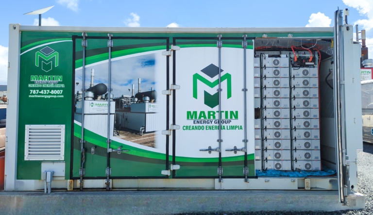 Battery Energy Storage System container with open doors, revealing air-cooled batteries inside.